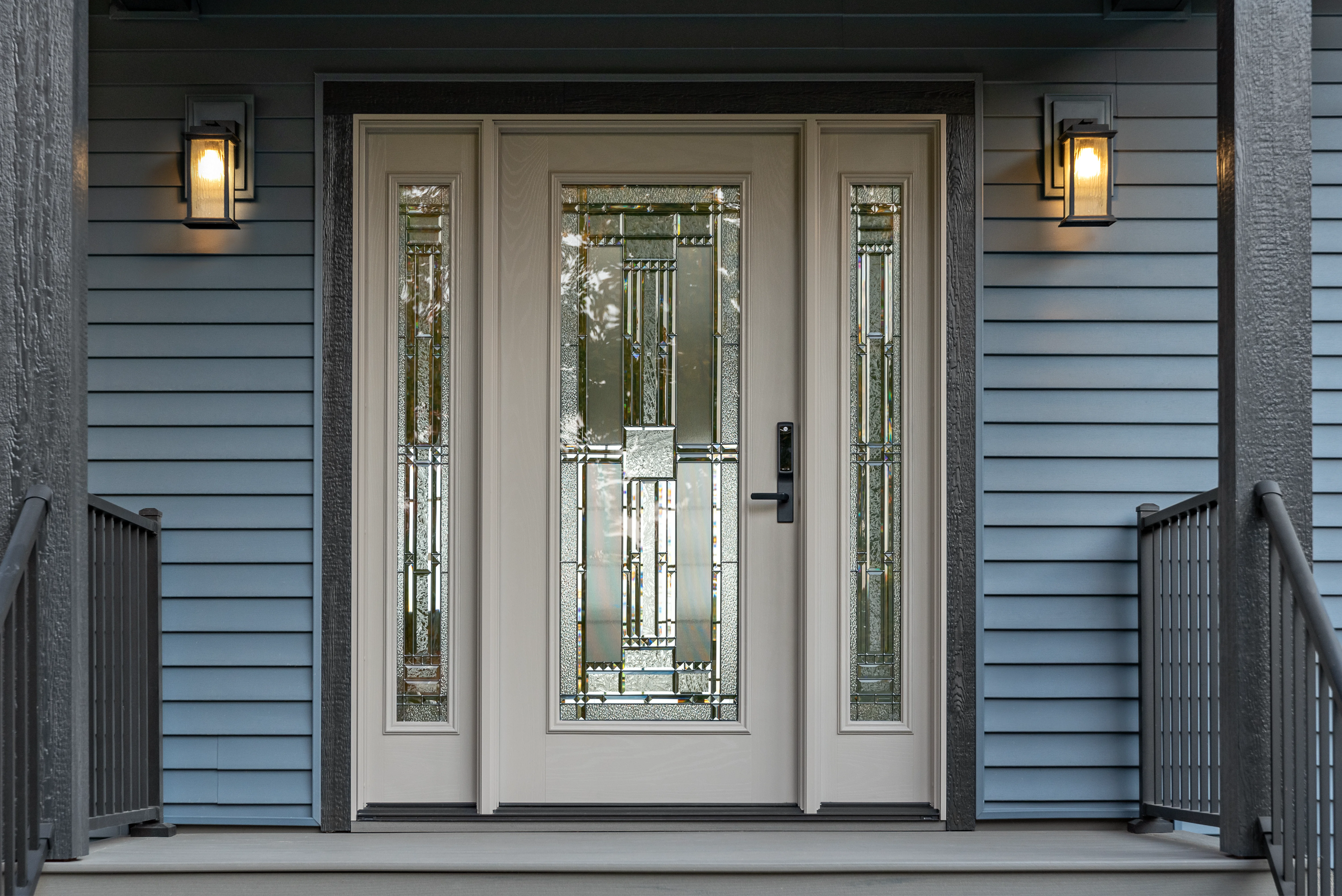Custom Ensemble™ entry door with decorative glass panels, enhancing curb appeal and security, installed by Engstrom's Siding and Window in Minong, WI.