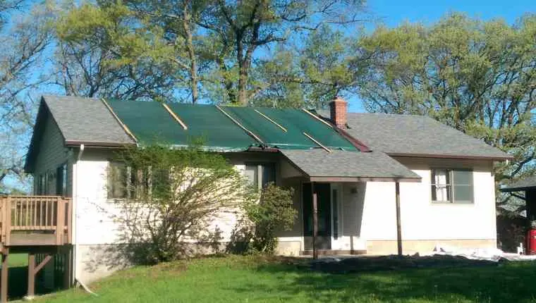 Before photo of residential asphalt roof replacement