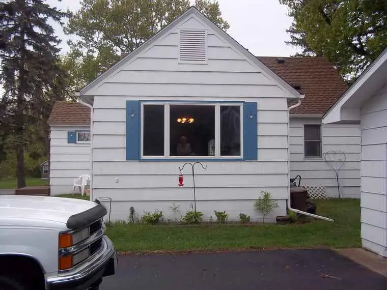Before photo of residential siding replacement project