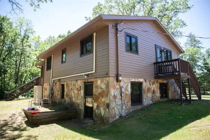 After photo of new replacement windows and vinyl siding installation